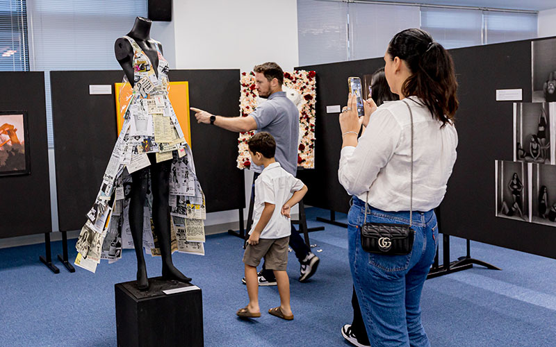 OFS High School parents viewing art exhibition