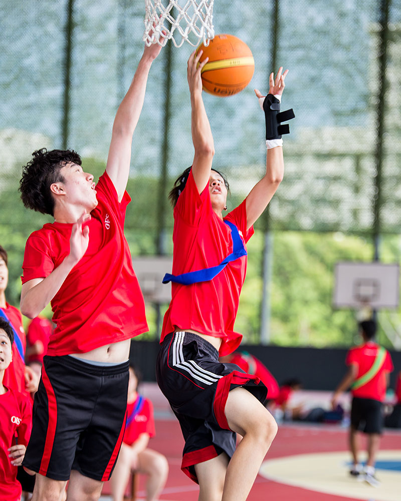 OFS High School students playing basketball