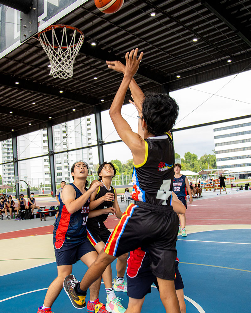 OFS High School boys basketball team playing against another school
