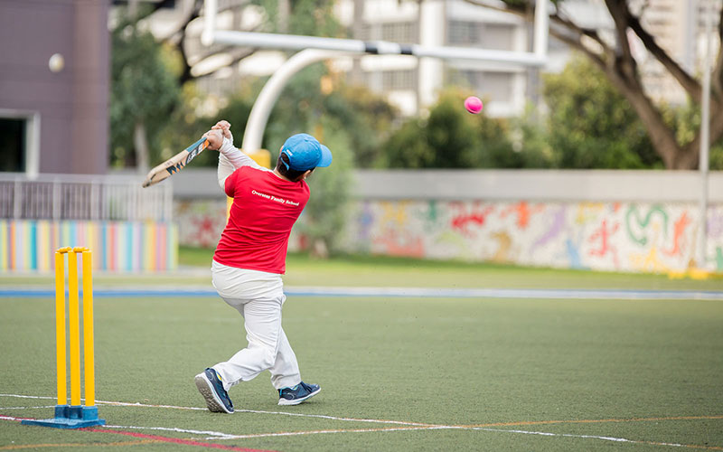 OFS Middle School student batting in a cricket game