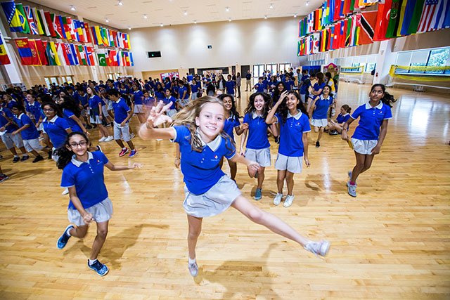 OFS Middle School students dancing in auditorium