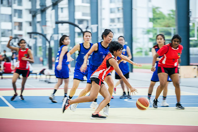 OFS High School girls basketball team playing on the field