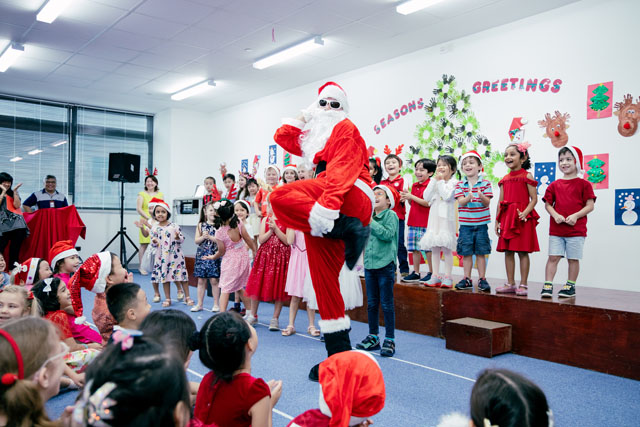 OFS Kindergarten students watching santa dancing