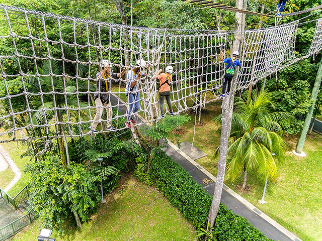 OFS High School Grade 8 students walking on rope during camp