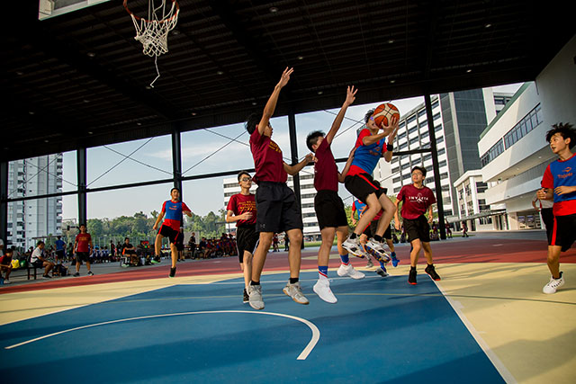 OFS Middle School boys basketball team playing on the basketball court