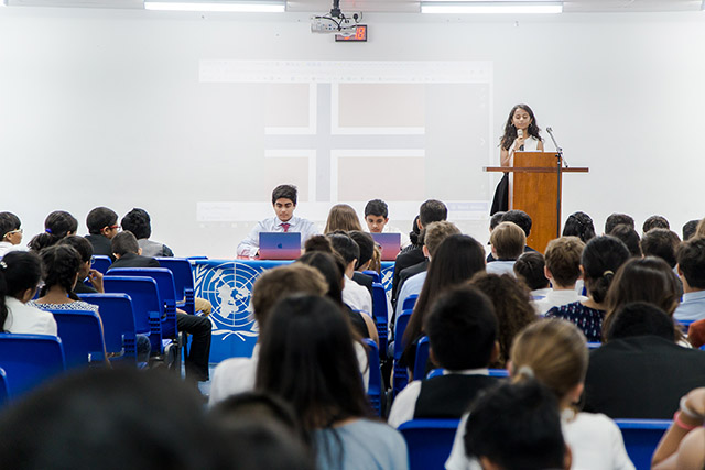 OFS Middle School Grade 7 students listening to speech during the Model United Nations event