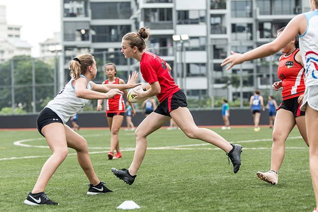 OFS High School Girls Touch Rugby team playing agains other schools