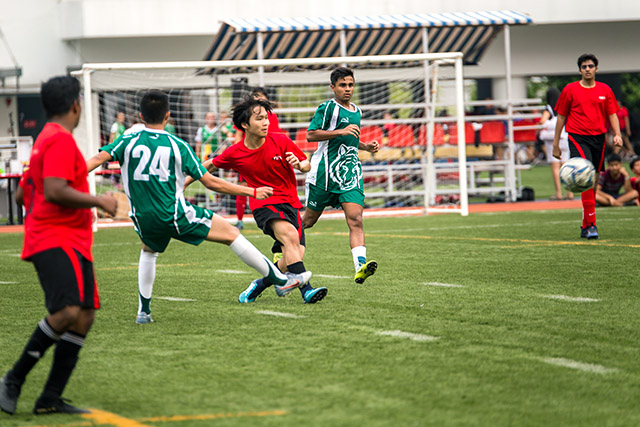 OFS High School football team playing on the field against other schools