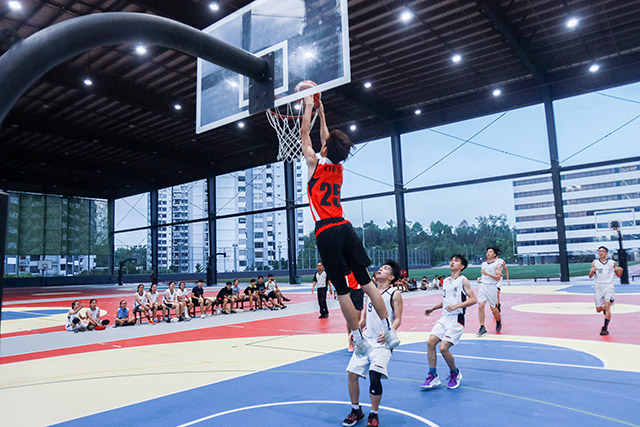 OFS High School students playing basketball in the 19U Lions Cup tournament on OFS basketball court