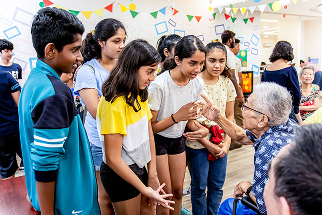 OFS Middle School Grade 7 students visiting elderly care home