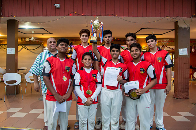 OFS High School Cricket Team holding a trophy