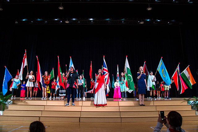 OFS High School students performing on the auditorium stage during United Nations (UN) Concert 2019